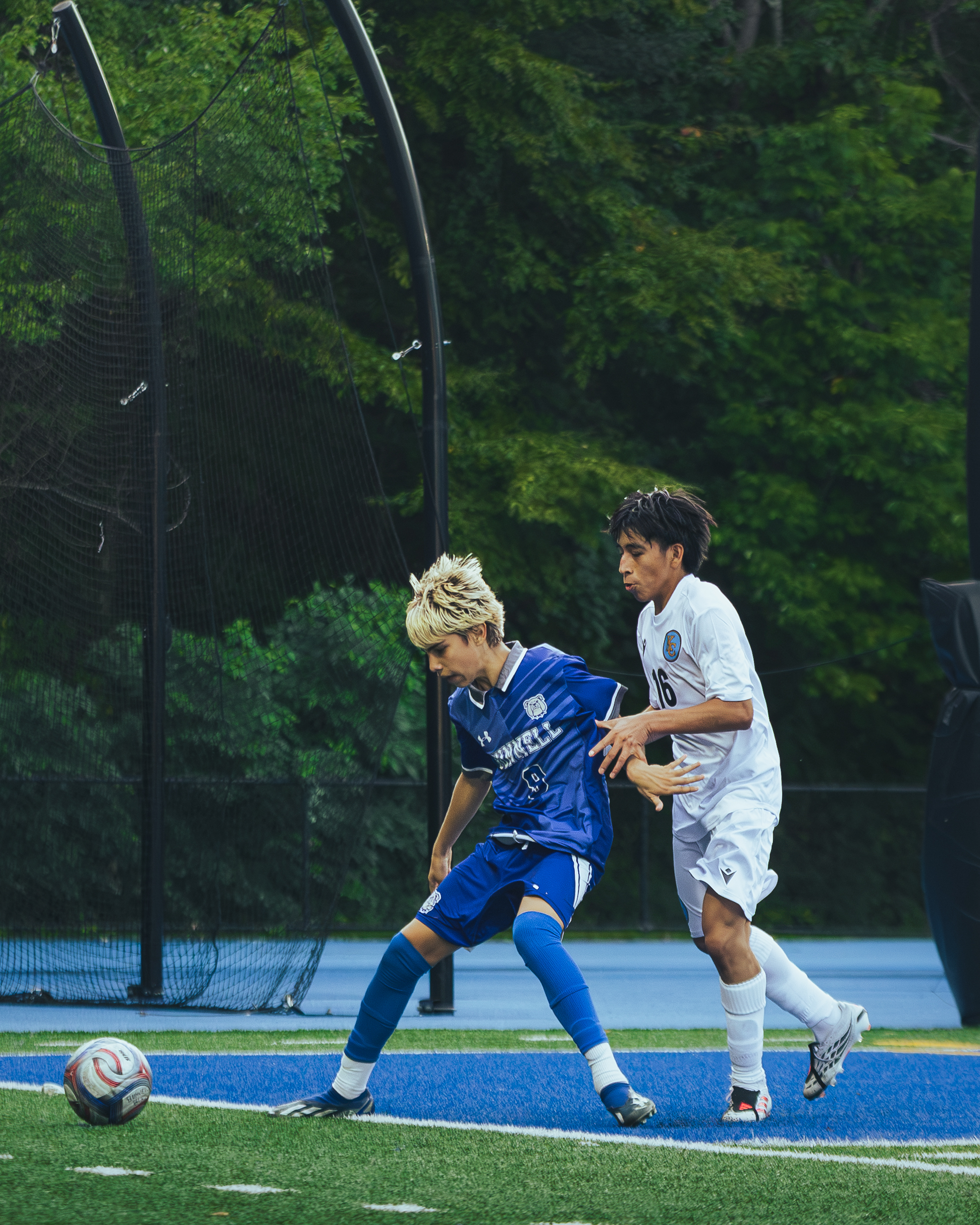 Two players competing for possession